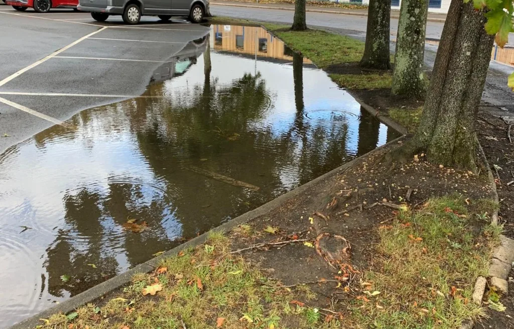Stay Ahead Of Potential Water Damage this image shows a large amount of standing water in a commercial car park