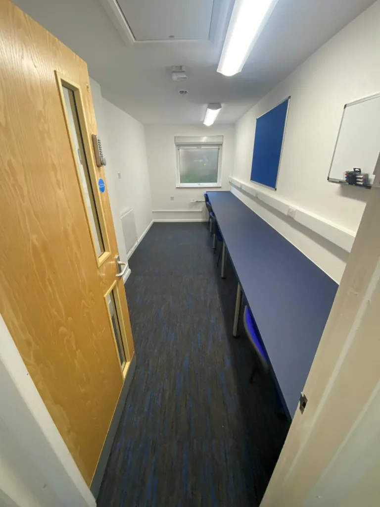 Refurbished staff office at Slated Row School with integrated desks and improved layout