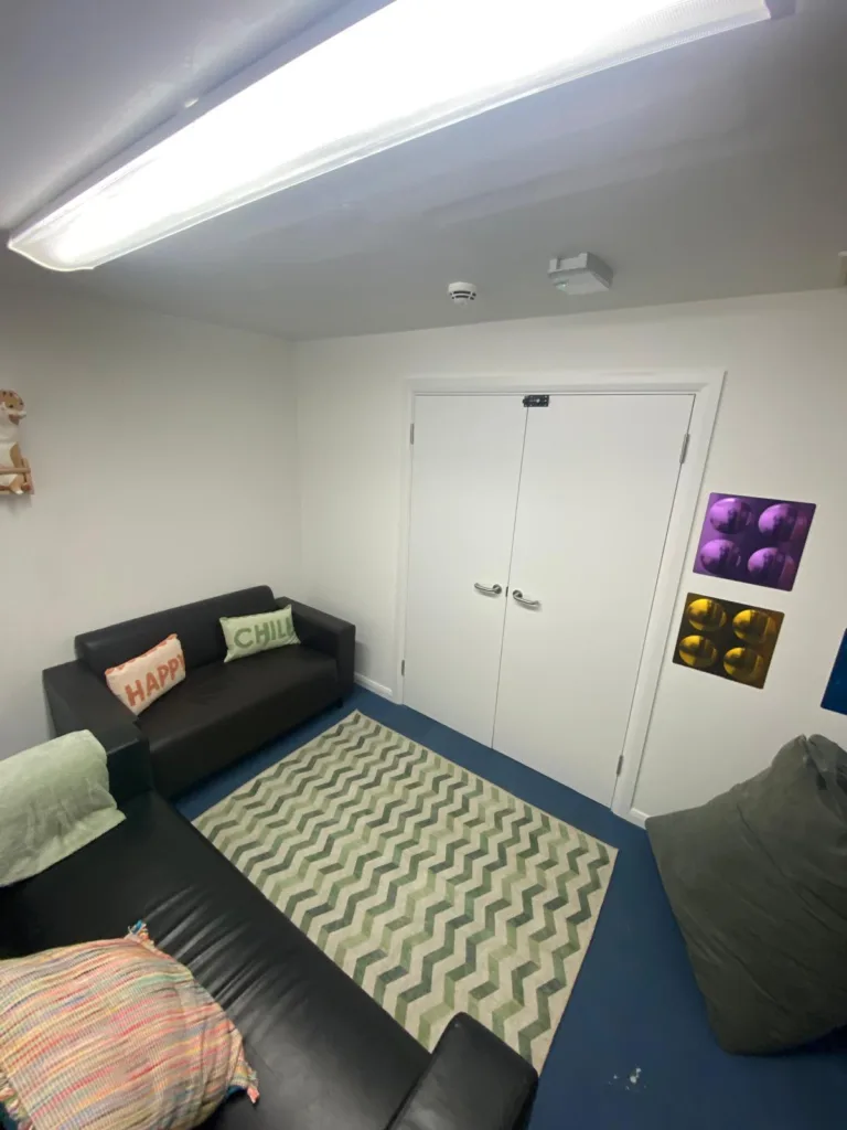 Refurbished breakout area at SEND school with soft seating and modern finish