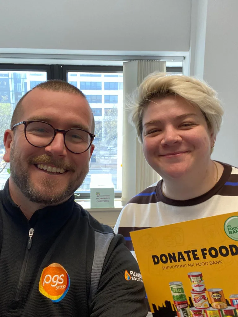 PGS Group delivering MK Food Bank donation crate to Milton Keynes Community Foundation team member