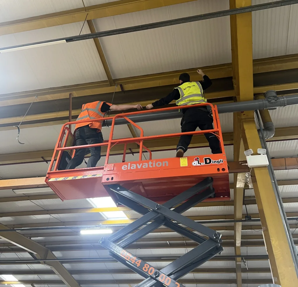 Working on a downpipe installation project for our commercial client.