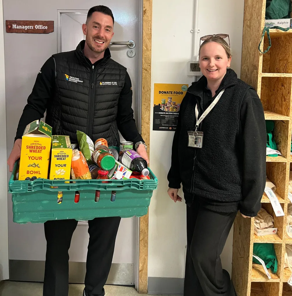 Donation crate filled with food items at Kids Play Childcare Knowlhill supporting MK Food Bank campaign