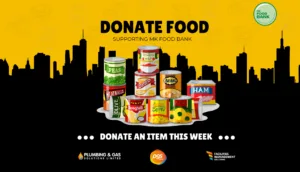 Workplace food donation campaign supporting MK Food Bank with collection crates and essential food items in Milton Keynes